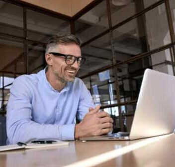 Contact Mastermind9 Business Groups - Man on Computer