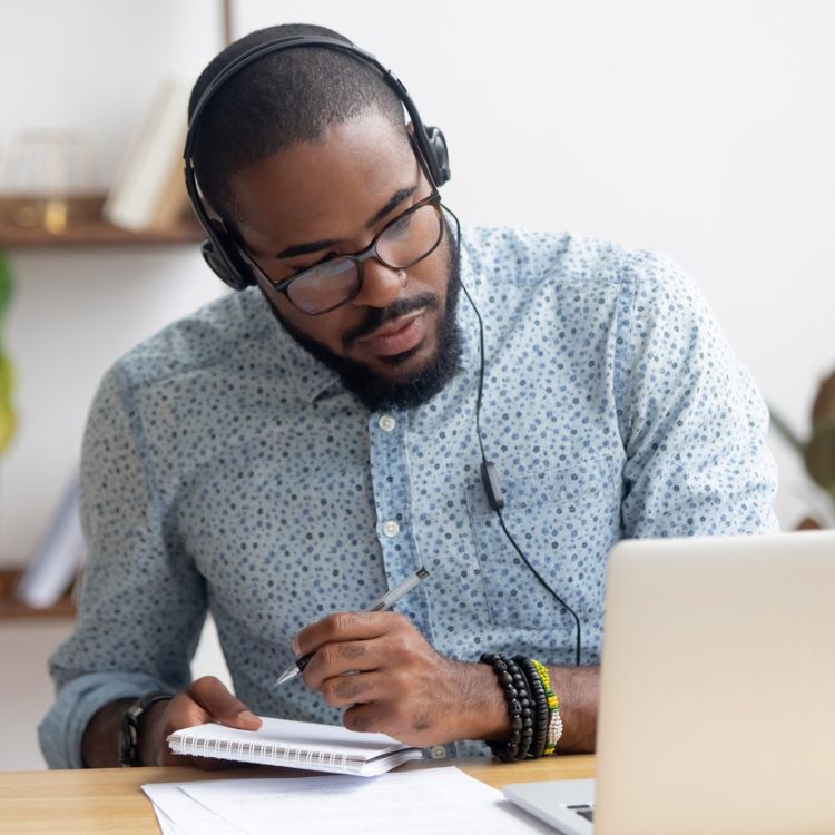 Portrait of African Male Working on Laptop