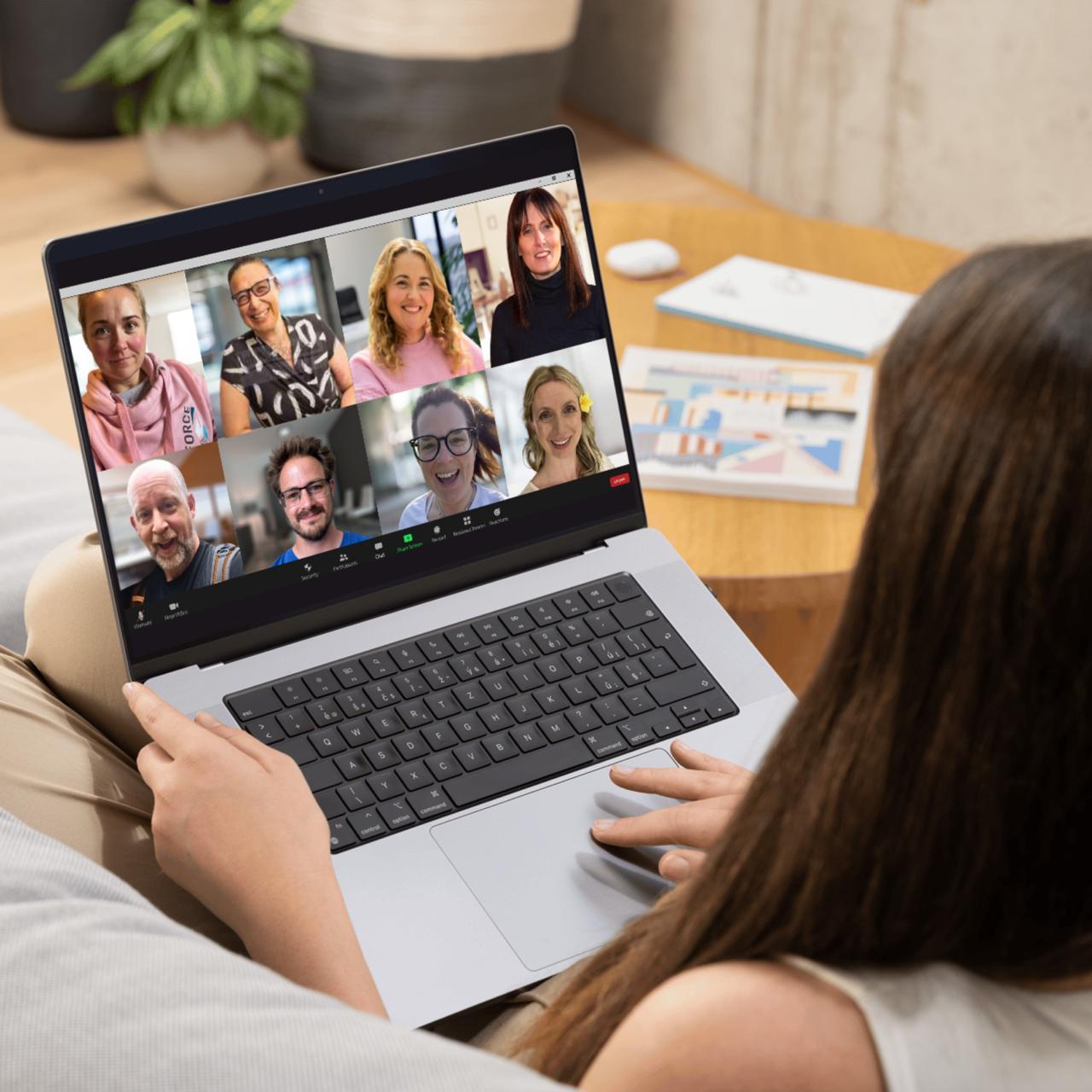 A business owner on a video call with their mastermind group, sharing ideas and support.